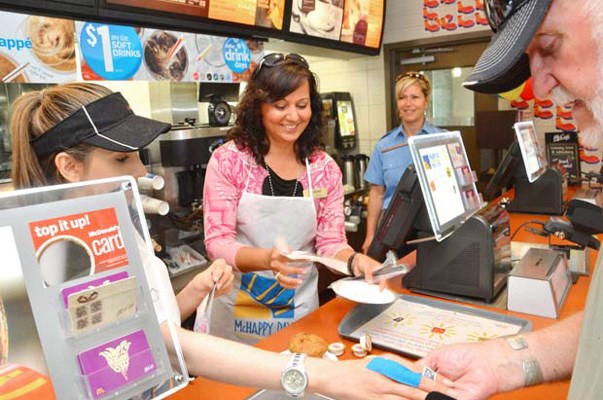 Fries with that?: Lara Graham, The Record's director of sales and marketing, serves up customers at the 20th anniversary of the McHappy Day fundraiser. The event raises funds for Ronald McDonald House Charities.
