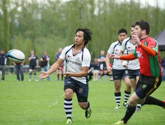 Maul ball: Burnaby Lake's Dan Schinbein, centre, and Nathan Lee, with ball, go into a maul against the Brit-Lions in a third division quarter-final game. Burnaby lost the match 28-22.