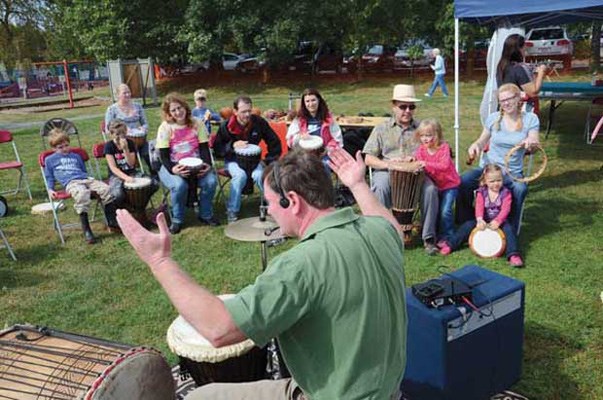 All together: Kids and adults alike had a chance to make some hands-on music during a drumming session at the Queensborough Urban Farmers Fall fair on Sunday, Sept. 18.