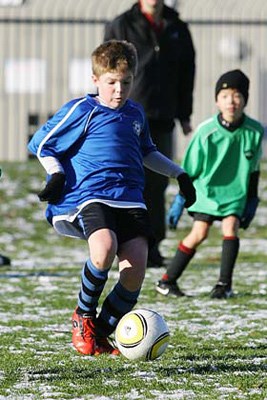 Eye ball: The New Westminster Phantoms defeated Burnaby 4-3 in minor soccer action at Moody Park last Saturday.