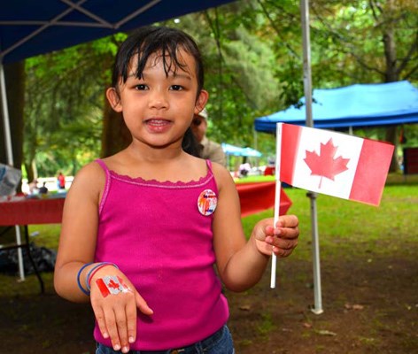 Seeing red: Andrew "The Crazy Canuck" Nicholson, left, celebrates Canada Day at Queen's Park with New Westminster MLA Judy Darcy.