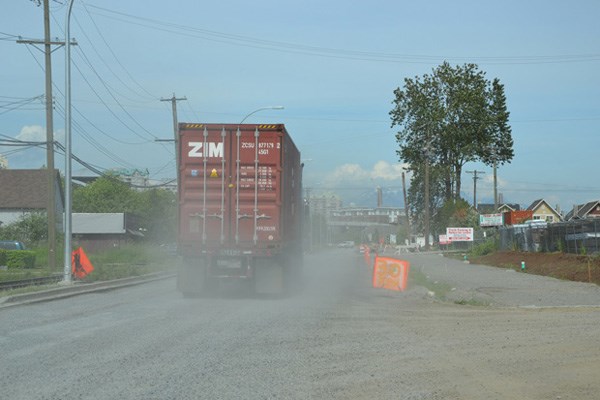 Dusty: Queensborough resident Terryl Plotnikoff says her four-year-old son now has to use a puffer because of the dust coming off Ewen Avenue (seen above). Construction is about two months behind schedule and local residents have had enough.