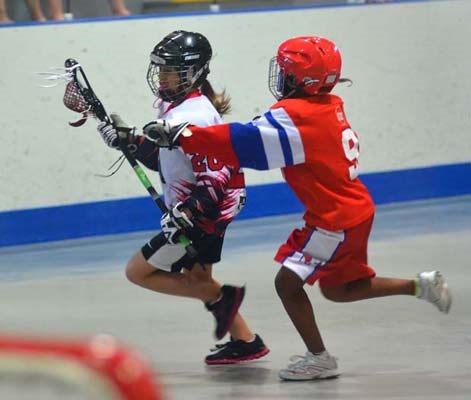 First-timers: New Westminster girls look like they are having fun against Nanaimo at the annual Dorothy Robertson girls' lacrosse tournament.