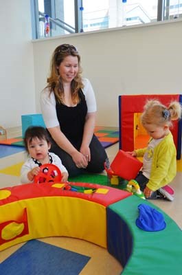 Jennifer Namana watches as Bella Namana, left, and Livia Brunelle, play at Kids & Company, a corporate-sponsored child-care centre, which held its official opening this week.