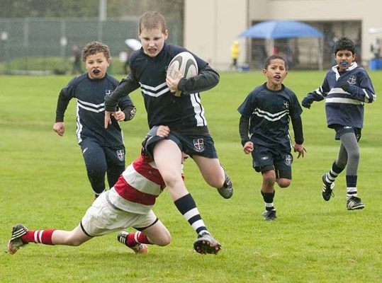 Getting started: Burnaby Lake youth, in blue, had a ramble against the Vancouver Rowing Club at the rugby club's mini jamboree at Burnaby Lake Sports Complex-East last Saturday.