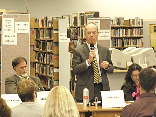Voice New Westminster school board candidate Jim Goring answers a question while fellow incumbents Michael Ewen, left and Lisa Graham, right, listen during Thursday night's school trustee all-candidates meeting in the NWSS library.