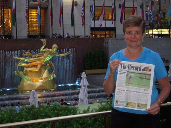 Cathy Lawrence took the Royal City Record to New York City in June. Her husband, Rick, took this picture in front of the statue of Prometheus at Rockefeller Center.