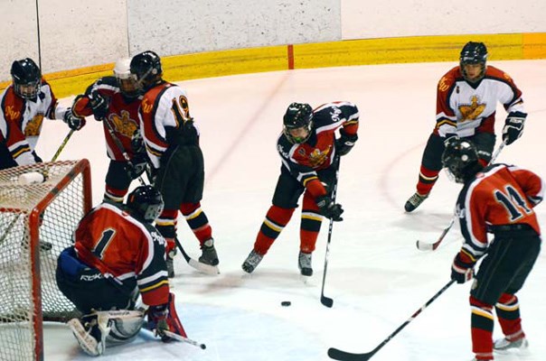 Goal: New Westminster C1's Paul Radnidge, hand raised, watches shot slip past goalie Garrett Cahill and into the net in 7-2 loss in all-New West bronze final.