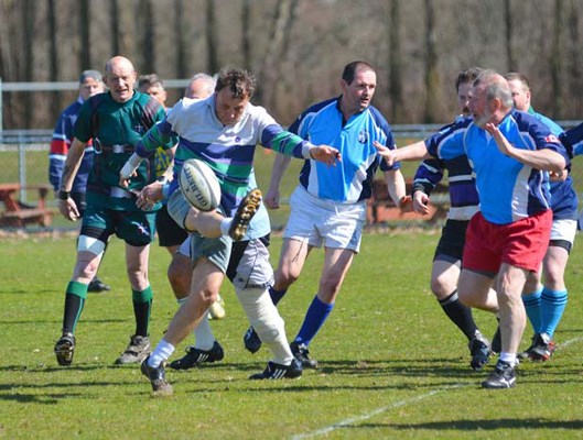 On tour again: The Twilighters and the Burnaby Buffaloes, in blue, played an exhibition oldies rugby match at Burnaby Lake Sports Complex-East in preparation for an upcoming tour to Japan.