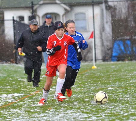 Snow ball: The New Westminster Demons defeated the Burnaby Girls Sparks 3-1 in an under-11 girls' cup soccer match at Mercer Stadium Park.