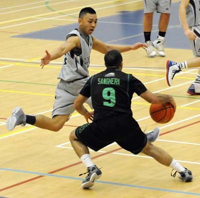 Lion kings: Burnaby Mountain, in black, rode a strong first quarter to its first-ever Burnaby/New Westminster district high school boys' basketball title, downing Byrne Creek 85-72 in the banner final last Friday.