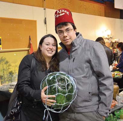 Treasures: Rowan and Colleen Williams came across a Shriner's hat and a glass float during the annual Hyack Antique Fair.