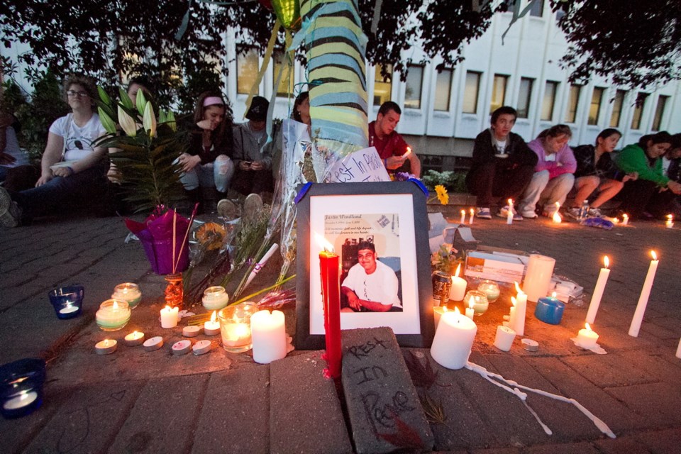 Friends and family gather on June 3, 2011, outside the Times Colonist building to remember murder victim Justin Wendland. He was stabbed on June 3, 2010.