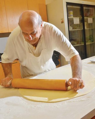 Rollin': Wally Komaryk makes perogy dough from scratch every month for the Holy Eucharist Ukranian Catholic Church's monthly dinner and sales.