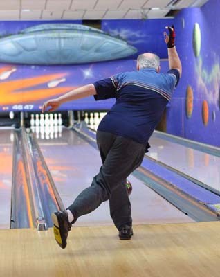 Rolling: Local bowlers filled the lanes at Rev's Bowling Centre on Lougheed Highway for the Can-Am 10pin tournament last weekend.