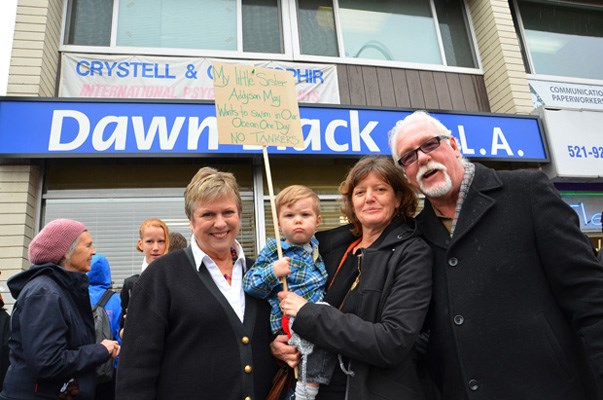 Pipeline protest: New Westminster MLA Dawn Black with pipeline protesters, Conner Beattie, Ingrid Beattie and his grandpa Stephen, who turned up at her constituency office. Protests were held at MLA offices throughout the province to convey opposition to the controversial plans to pipe crude from the Alberta oil sands. Black and her NDP party also oppose the Enbridge pipleline expansion. The party hasn't taken a stand on the Kinder-Morgan Pipeline expansion proposal.