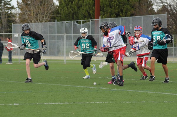 Action pic: No. 0 Frank Darby, in white, and No. 10 Taylor Jensen battle it out against Vancouver in under-14 at the B.C. Tier 2 field lacrosse championships in Victoria.