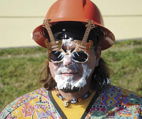 Students at Lord Tweedsmuir elementary school raised approximately $1,200 during a pie-throwing event on Wednesday. Kids who raised money got a chance to throw a pie in their favourite teacher's face. Here, Mr. Laforest shows off some stylish sunglasses amidst the pie he received from students.