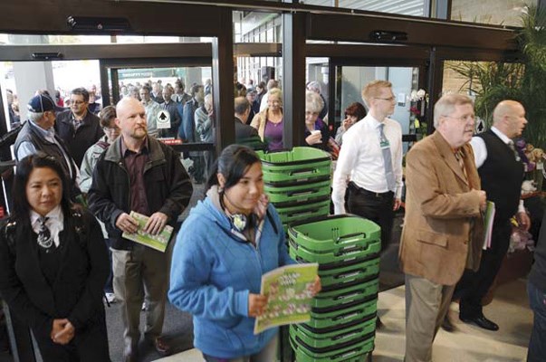And they're off!: The first customers arrive at the grand opening of Thrifty Foods.