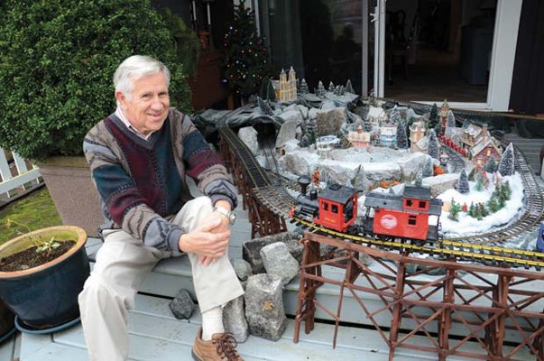 Joy to the neighbourhood: Queensborough resident Ross Hood builds a holiday train each Christmas that's enjoyed by his neighbours. He sets up the elaborate train on the back deck of his home.