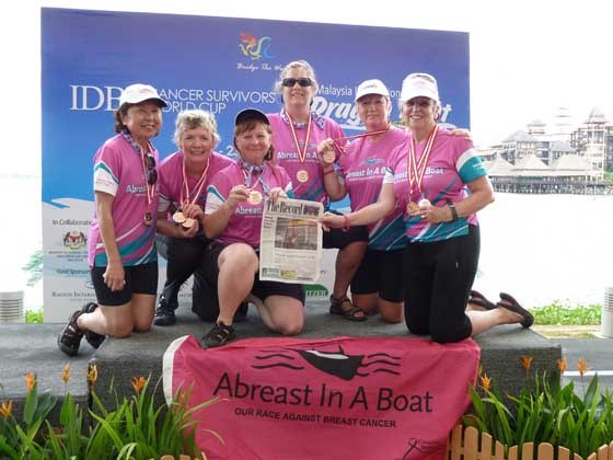Paddling for a cause: New Westminster residents (from left) Patricia Tanaka, Orrie Babiuk, Evelyn Smoliak, Esther Newcombe, Eleanor Vandergaag, and Judi Clark were members of the Abreast In A Boat crew who went to compete in the International World Cup Dragon Boat Festival in Putrajaya, Malaysia, Oct. 22 and 23. They took their Record along for the ride.