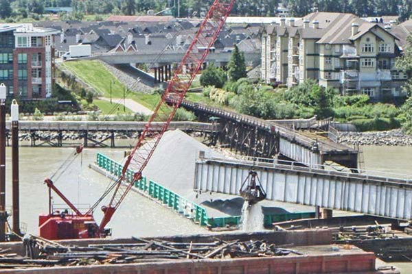 July 3: Fraser River Pile and Dredge begin attempts to dredge up the damaged pier parts.