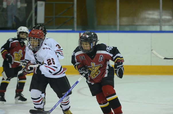 Ben Stewart goes for a skate in New Westminster's 6-0 win over the North Shore Winter Club in atom A Tier 3 final four playoff.