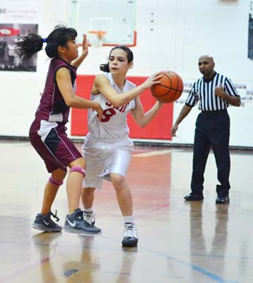 Right Knights: The St. Thomas More Knights defeated Little Flower Academy 54-29 in the Lower Mainland independent high school junior girls' basketball championships.