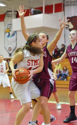 Right Knights: The St. Thomas More Knights defeated Little Flower Academy 54-29 in the Lower Mainland independent high school junior girls' basketball championships.