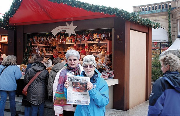 European vacation: Elizabeth and L.J. White took their Record to the Christmas Market in Cologne, Germany, one of their stops on a cruise up the Danube from Budapest to Amsterdam. The photo was taken just outside the city's cathedral.