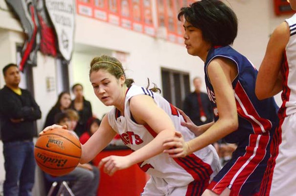 Drive in: St. Thomas More's Leah Purdey drives to the bucket against Fraser Heights en route to the senior girls' Chancellor basketball tournament title last week.