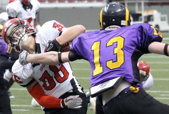 Touchdown time: St. Thomas More running back Jordan Mckenzie, with ball, rushed for 70 yards and intercepted a pass to help the Knights win the B.C. JV high school football championship at B.C. Place on Saturday.