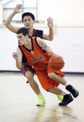 Gone Gair: New Westminster's Jordan Zeer, with ball, drives into the paint in opening win over West Vancouver at the Bob Gair Classic last Wednesday.