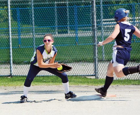 Cool at first base: Burnaby Hurricanes first base Jackie Bain gets the out in a 6-3 victory over Calgary Rage on opening day of the Western Canadian junior fastpitch championships at Squint Lake Park.