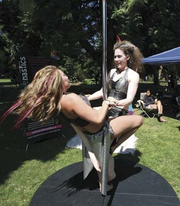 Spinning: From left, Jessica Gilmartin and Laura Taylor, instructors from Polenastics Dance and Fitness Canada, were at the second annual pride event in New Westminster's Tipperary Park