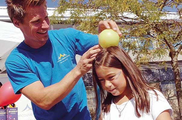 Six-year-old Teilani Rasmussen becomes part of the performance for Travis Johnson of the Vancouver Circus School at last year's Artists on the River festival. This year's festival is set for Friday and Saturday, Sept. 23 and 24.