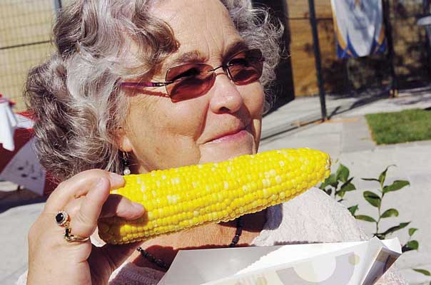 Fresh flavours: Betty McIntosh enjoys some fresh corn at the 2010 Artists on the River festival. This year's edition of the festival is set for Friday and Saturday, Sept. 23 and 24.