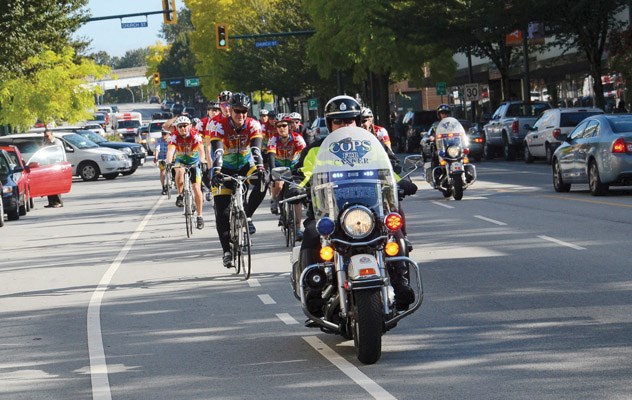 Here they come: Cops for Cancer's Tour de Coast/ Greater Vancouver team make their way into the Royal City on their second from last day of the eight day ride heading from Coquitlam to Powell River to Pemberton and back again.