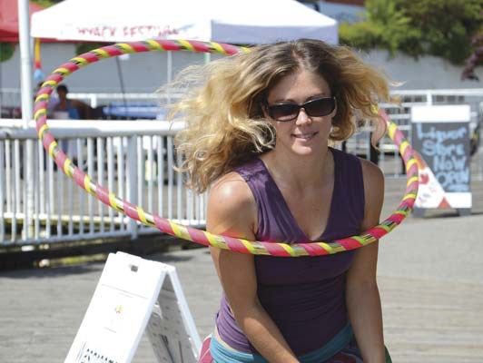 The Hoop Fairy, Pam MacDonald, performs during this past weekend's FraserFest celebrations at Westminster Quay.