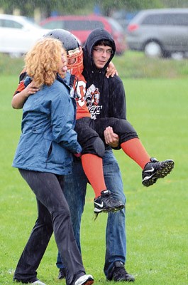 Royal City Hyacks peewee player Yanni Angelopoulos is carried off the field after sustaining a minor leg injury on Sunday at Ryall Park in Queensborough. Angelopoulos returned to action in a 37-0 win over the Burnaby Lions.