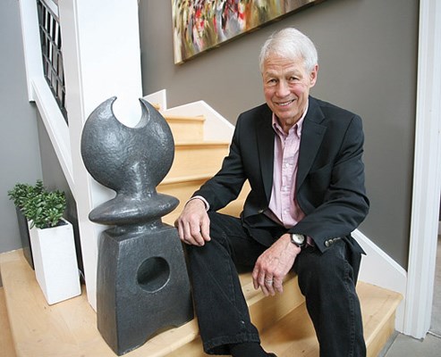 A work of art: Burnaby's Keith Rice-Jones poses next to one of his sculptures at the Van Dop Gallery's recent launch of the Art of the Garden exhibition.