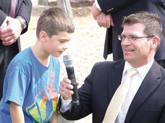 Duncan Conner, left, along with F.W. Howay principal Ken Millard, thanks Education Minister George Abbott for new funding for Howay's playground.