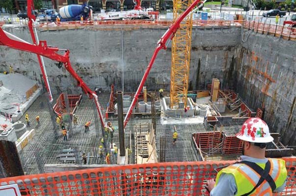 Plenty of cement: A construction worker takes part in the largest cement pour of the New Westminster civic centre construction project.