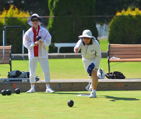 Taking a shot: Josephine Lee takes a shot at the New Westminster Lawn Bowling club, while Nancy Leung looks on. The club held its Labour Day club tournament on Sept. 2.