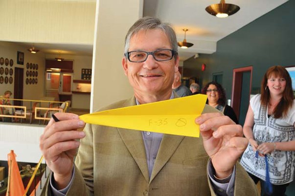 Supporting staff: Coun. Chuck Puchmayr took part in the city employees' fundraising campaign for the United Way, which included a paper airplane contest at city hall on Monday.