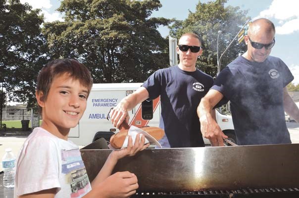 Serving up support: Hot dogs were on the menu at the New Westminster firefighters' barbeque Aug. 24 at Royal Columbian Hospital, held in support of the Hospital Employee's Union.
