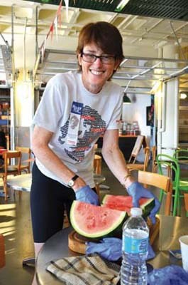 Feeding the masses: Dr. Kathy Jones, who has organized the Terry Fox Run in New Westminster for the past five years, has been taking part in runs in honour of the Canadian hero since she was a medical student. Here she prepares some post-run snacks for participants.