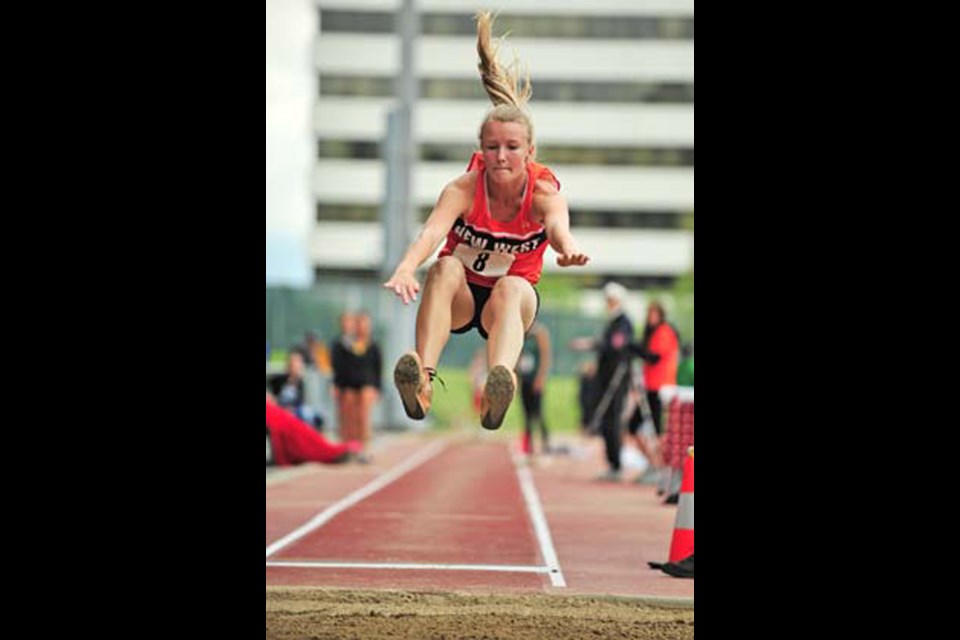 A long jump: New Westminster's Natasha Lazecki won a silver medal in the long jump at the 46th annual B.C. high school track and field championships at Swangard Stadium on Saturday.