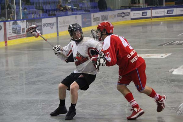 Island blues: The New Westminster Salmonbellies, in red, gave up six goals in the final period in a 12-8 loss to the Nanaimo Timbermen in Western Lacrosse Association action in the Hub City on Sunday.