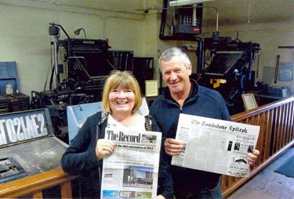 In Tombstone, Arizona, "the town too tough to die," Loree and Ralph Baker took this photo with The Record and an 1881 replica of the Tombstone Epitaph and the Epitaph newspaper printing press. The 1881 edition included reports on the famous gunfight at the O.K. Corral, which is close to the newspaper's office.